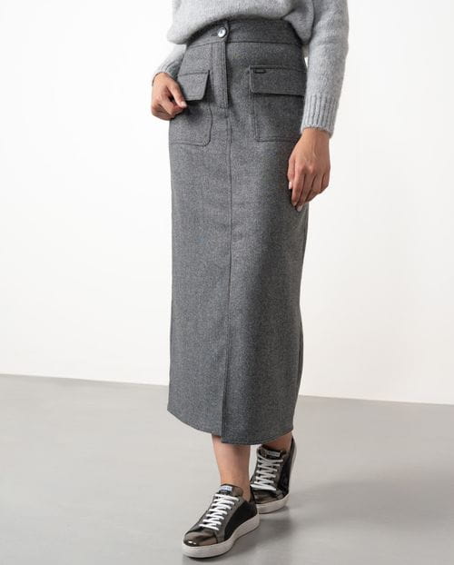 Straight midi skirt with patch pockets and front vent  made from cheviot wool fabric