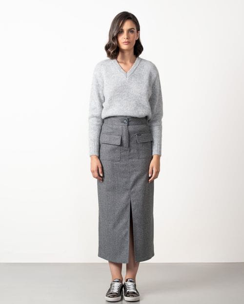 Straight midi skirt with patch pockets and front vent  made from cheviot wool fabric