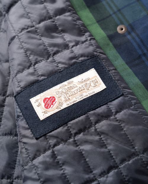 <p>Parka acolchada en algodón encerado de cuadros</p>