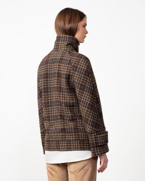 Double-breasted short coat with hidden fastening and funnel collar made from checked wool fabric