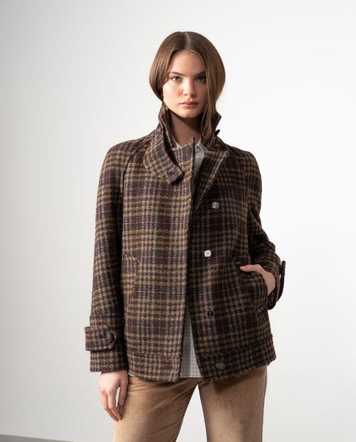 Double-breasted short coat with hidden fastening and funnel collar made from checked wool fabric