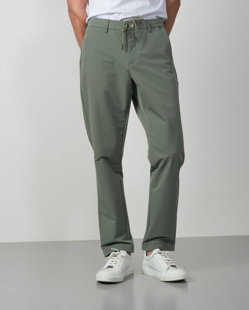 Trousers with cord and elastic waistbrand made of flexible technical fabric
