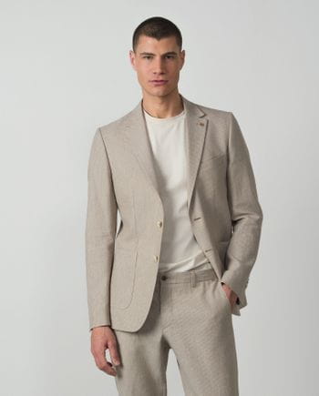 Americana slim fit sin forro y desestructurada realizada en rayitas de lino-algodón