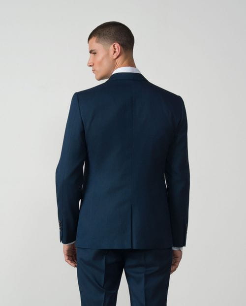 <p>Traje recto <em>extra-slim fit</em> en microestructura bicolor elástica</p>