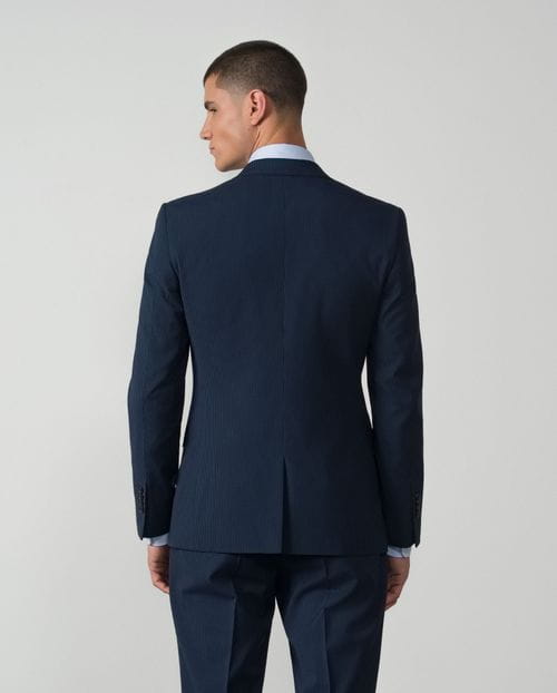 <p>Traje<em> extra-slim fit</em> en un tejido mil rayas elástico</p>